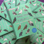 Children's book titled 'Amazing Vultures Fact and Activity Book' with vulture illustrations on a green background.