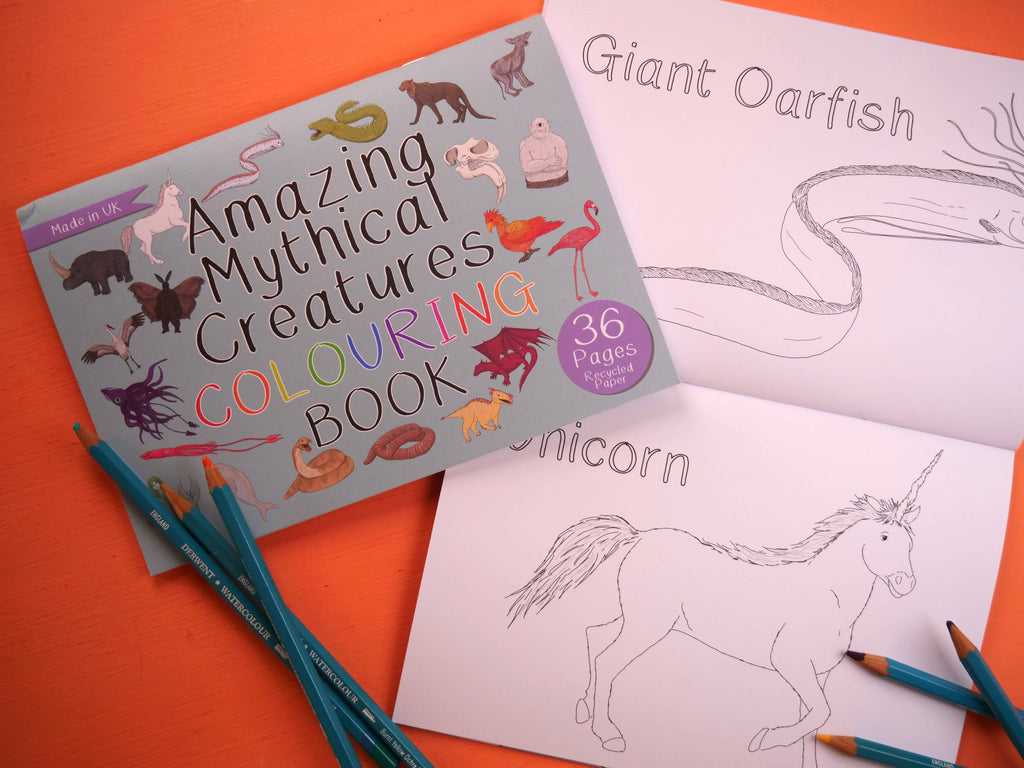Coloring book titled 'Amazing Mythical Creatures' with coloring pages of a unicorn and giant oarfish on an orange background.