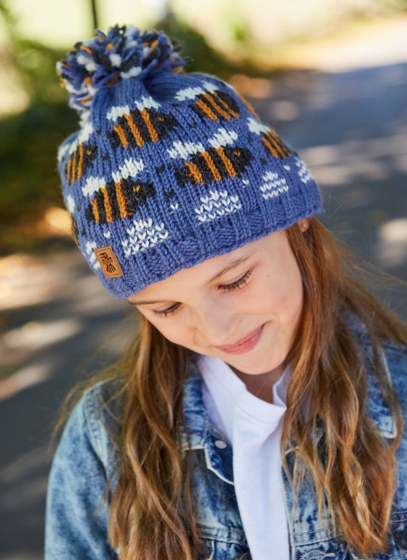 Child hat in blue with bee design all around, bobble on the top