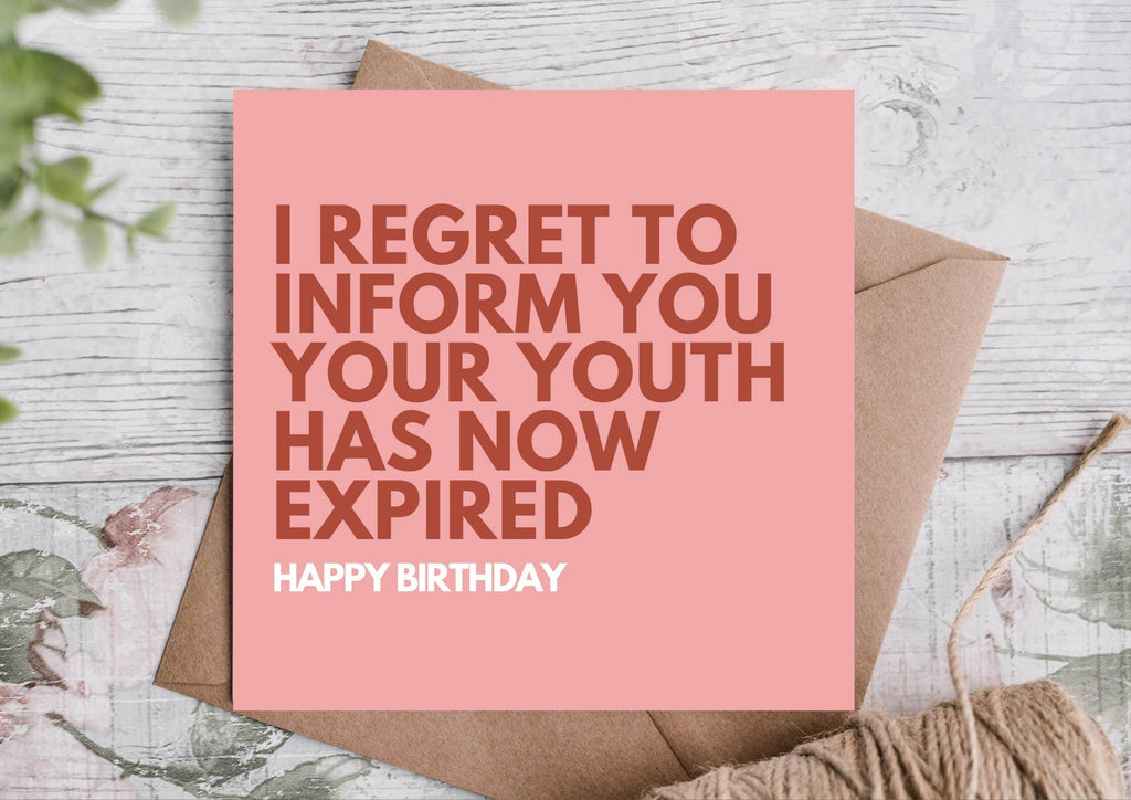 Pink birthday card with the writing - I regret to inform you your youth has now expired - written in bold on the front. 