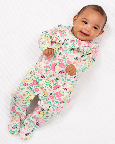 Sleepsuit with pink yellow and green all over nature print