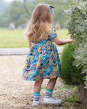 Patchwork planet dress in bright colours with flower design all over 