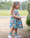 Patchwork planet dress in bright colours with flower design all over 