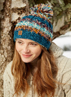 Utrecht bobble beanie in a blue brown, red & white mix. 