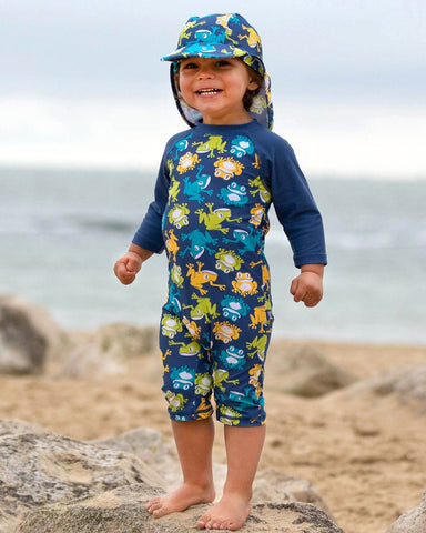 Sunsuit blue with frogs printed all over 