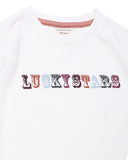 Ecru colour long sleeved t-shirt with lucky stars printed across the front 